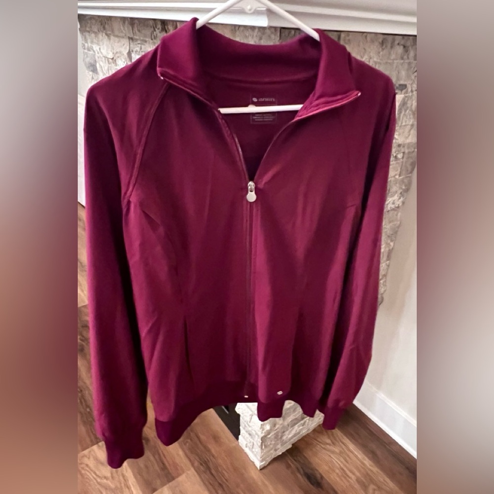 Women’s Cherokee Infinity Zip Front Jacket with pockets.